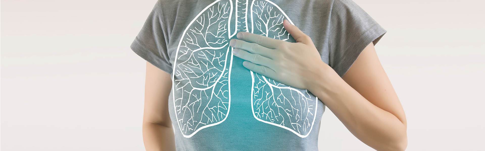 close-up of woman's chest with illustration of lungs over top.