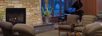 Fireplace with lounge area and piano in East Wing