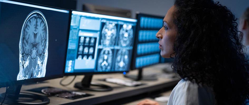 female doctor looking at a brain scan.