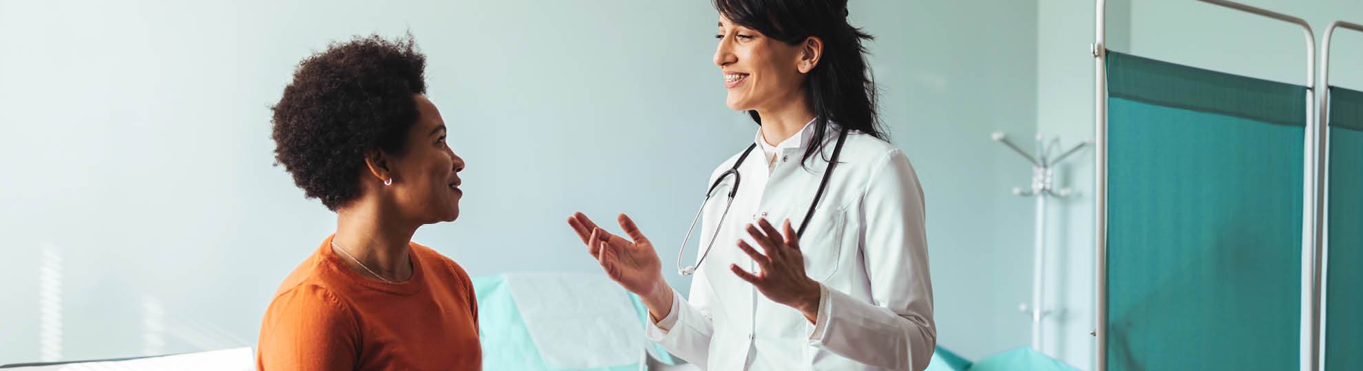 Patient and doctor in an exam room.