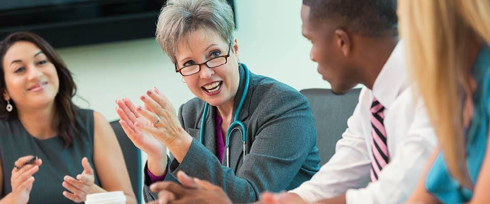 physician with patient smiling