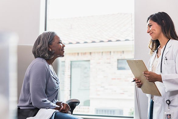 female doctor talking to patient.