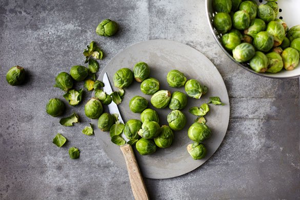 Brussels sprouts on a grey table.