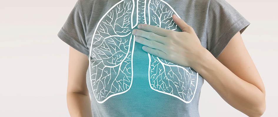 close-up of woman's chest with illustration of lungs over top.