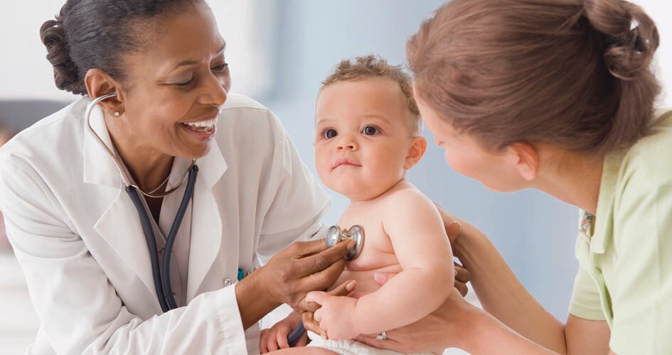 Pediatrician with mom and baby