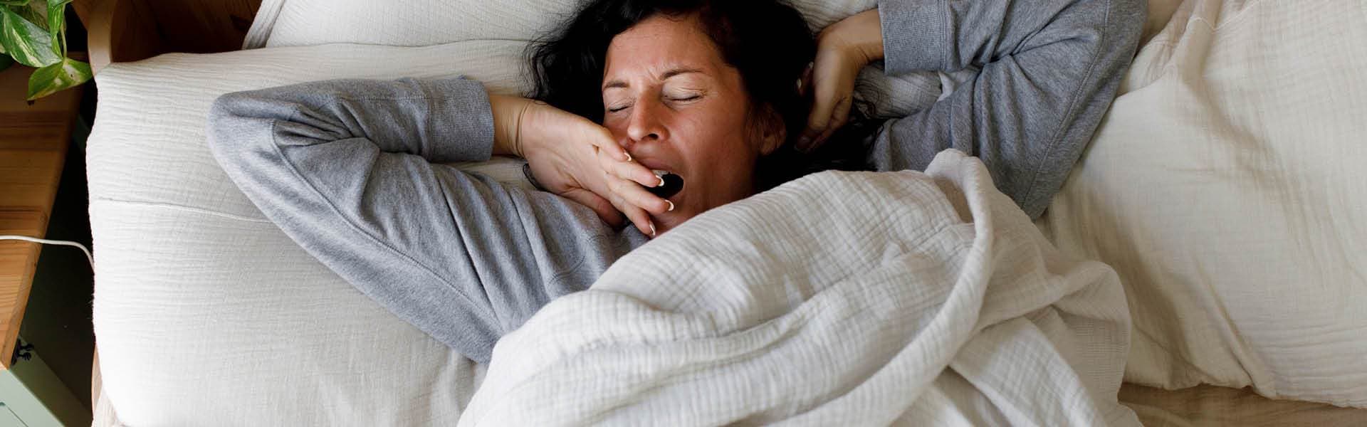 woman stretching, waking up.