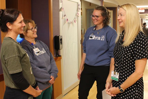 Avera nurses talking in a hallway.