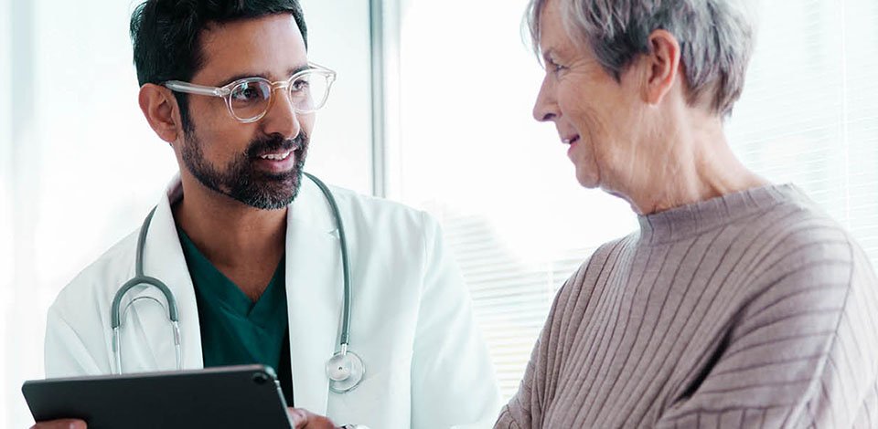 physician with patient smiling