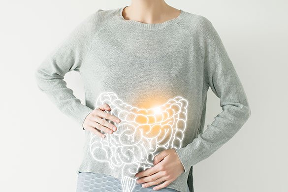 woman with digital highlighted area of her intestine.